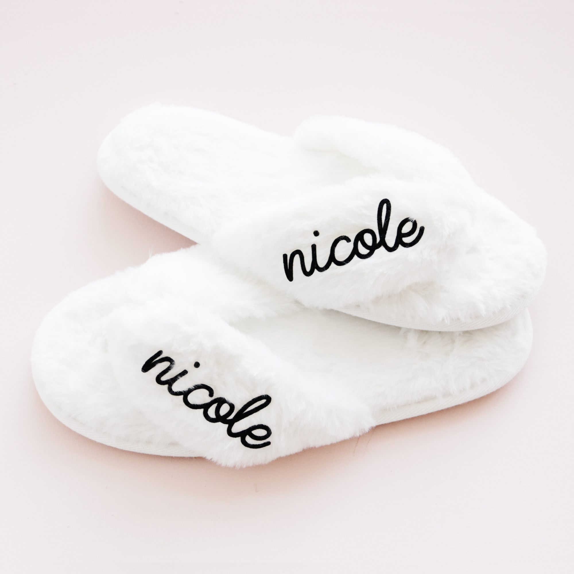Cozy personalized faux fur slippers featuring a custom name design. Soft and stylish, these plush slippers make the perfect gift for bridesmaids, brides, birthdays, or self-care moments at home. Also great for retirement gifts for women.